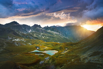 Landscape sunset Caucasus mountains and lake aerial view wild nature breathtaking evening scenery beautiful travel destinations summer season