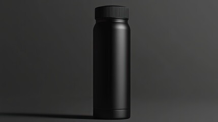 Sticker - A Black Matte Bottle Stands Against Dark Background