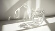 © STwul - Sunlit glass, textured surface, window shadows, minimalist still life, home decor