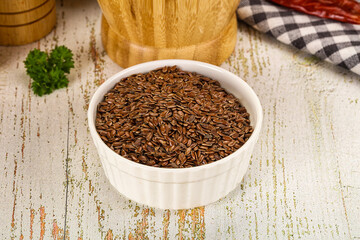 Wall Mural - Brown flax seeds in the bowl