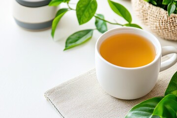 Wall Mural - Warm tea cup on table with green plants for a relaxing morning or afternoon break time