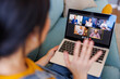 © Impact Photography - Woman having conference call while working remotely from home