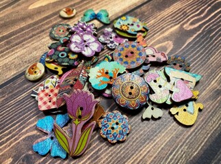 Different decorative buttons art design for babies kids set collection objects on wooden background 