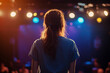 © Tetiana - Stand-up comedian performing live on stage with microphone, vibrant concert ambiance created with generative AI