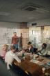 © Zamrznuti tonovi - Creative business team brainstorming during meeting in modern office
