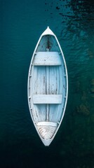 Wall Mural - Mysterious boat in foggy lake reflecting calm water at dawn