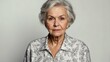 © Alteisen Riese - elderly caucasian female in casual wear on white background model portrait looking serious for ad concept space for text