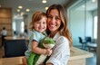© Viktor - Happy mother holds child at reception desk in dental clinic. Smiling family enjoys pleasant moment before visit. Child holds toy. Indoor shot captures warm, joyful atmosphere. Calm, relaxed vibe.