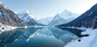 © Temteen - A quiet snow-covered lake reflects the surrounding mountains, serene, natural, mountain