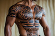 © Татьяна Евдокимова - Close up of a muscular male torso with traditional Polynesian tribal tattoos covering the chest, shoulders, and arms