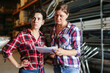 © JackF - Female warehouse owner and manager keep track of products in the warehouse
