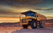 © MaxSafaniuk - Mining truck in open-pit mining. Heavy machinery Construction equipment. Haul truck at construction site. Mining civil works, Earthmoving. Off highway Trucks on construction. Haul dump truck on sunset