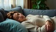 © Viktor - Woman rests peacefully on cozy sofa. Relaxed and serene after sleepless night. She enjoys moment of tranquility at home. Comfortable casual attire. Evening autumn scene. Contentment and rejuvenation.
