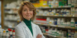 © PhotoProAD - A woman in a white lab coat stands in front of a pharmacy shelf