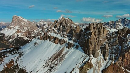 Wall Mural - aerial panorama view of amazing rocky mountains in snow at sunset, dolomites, italy, 4k