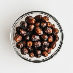 Wall Mural - Top view of a glass bowl filled with dried dates.