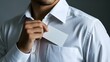 © WIWIK - Young man takes out a blank business card from his shirt pocket, close up,card,hand,business