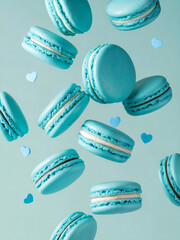 Wall Mural - Valentine's Day, A vibrant scene of pale blue macarons, a popular French dessert, suspended in mid-air against a pale blue background