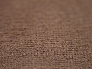 Aufkleber - The image is of a carpet with a brown color