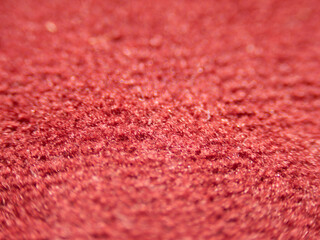 Poster - A close up of a red carpet with a fuzzy texture