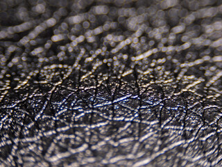Fototapete - The image is a close up of a leather surface with a lot of texture