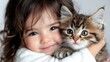 © Giman - Toddler girl hugs kitten, indoor portrait, friendship, pet love, animal care, website banner