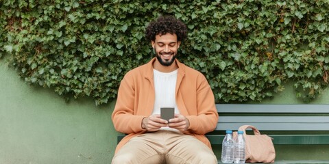 Aufkleber - Contemporary Urban Fintech Casual Indian Man with Digital Wallet on Smartphone - Green Park Eco-Vibes for Modern Financial Management and Lifestyle Integration