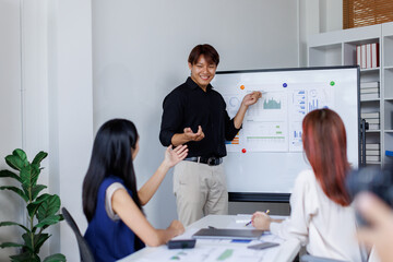 Wall Mural - Business people planning at whiteboard in office meeting,team business work with documents tax laptop computer in office.