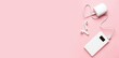 © Pixel-Shot - Modern power bank and case for earphones on pink background with space for text