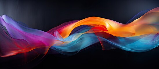 Poster - Colorful abstract wave pattern in vibrant shades of orange, blue and pink on a smooth black background creating a blurred artistic effect.