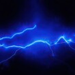 © Withun - Blue light streaks resembling lightning in a space-themed background, universe, streaks, stars