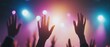 © Khamidhilal - Concert crowd, raised hands, stage lights, music event.