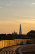 © yaqui_villegas - A breathtaking view during golden hour featuring London's iconic skyscraper, the Shard, juxtaposed against a warm, soft sky that evokes feelings of serenity and wonder in London