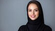 © Giman - Smiling woman, hijab, portrait, studio, gray background, beauty