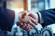 © nsit0108 - Two businessmen shaking hands, with gears in the background, symbolizing a successful partnership in an industrial setting