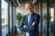 © Fazla - Portrait of a Successful Senior Businessman Consultant Looking at Camera and Smiling Inside Modern Office Building, Expertise and Professional Confidence Generative AI