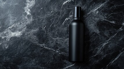 Leinwandbilder - Elegant top view of a sleek dark bottle placed on a polished black marble surface in a minimalist style, ideal for creative product presentation.