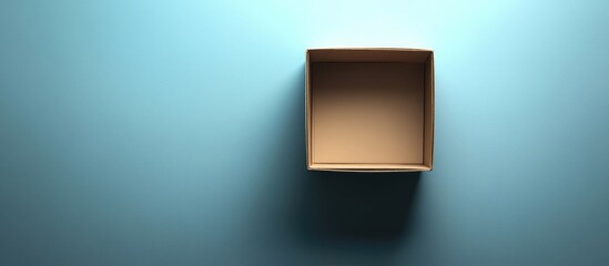 Fototapete - Flat Lay of an Unpacked Surprise Box on Light Blue Background with Empty Space for Text and Soft Shadows Creating Depth