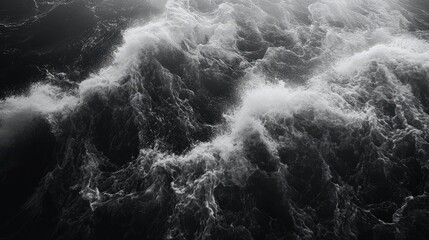 Aufkleber - Dynamic ocean waves crashing onto the shoreline creating a dramatic contrast of movement and texture in monochrome.