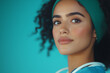 © Artificial South - Confident Gaze: A young woman with dark curly hair and a teal headband looks directly at the camera with a self-assured expression, wearing a teal medical scrub top.