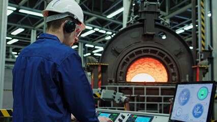 Poster - Operator oversees molten metal pouring in a large industrial facility during daylight hours