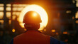 © roongtiwa - Construction Worker Silhouette: A construction worker silhouetted against the vibrant setting sun,  a beacon of determination in the heart of a bustling construction site.