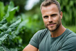 © Marut - confident farmer stands amidst lush green vegetables, showcasing his dedication to agriculture and healthy lifestyle. His smile reflects pride in his work