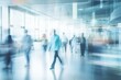 © juliars - Blurred motion of doctors and business people walking in a modern hospital hallway