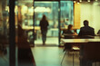 © K'kriang Krai - blurred office scene with people working and walking, creating dynamic atmosphere