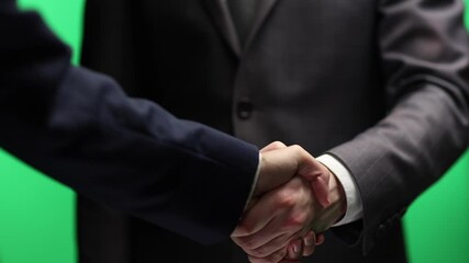 Wall Mural - Businessmen's handshake in close-up on a white background