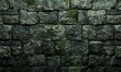 © Tanya - Rough stone wall with moss growth and a dark green tone, natural texture, aged appearance