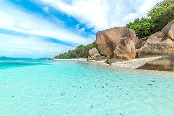 Wall Mural - Anse Source d'Argent beach under a cloudy sky