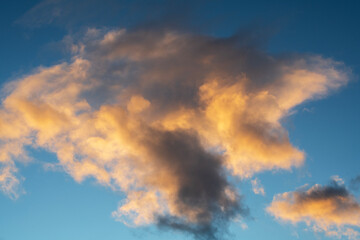 Wall Mural - beautiful orange sunset clouds on the blue sky. sky background.