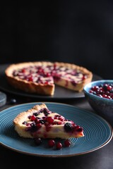 Canvas Print - Piece of delicious currant pie and fresh berries on grey table, space for text